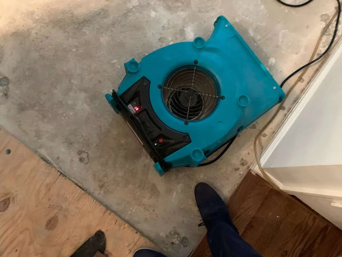 Air mover drying subfloor during Leak Detection & Repair in Venersborg